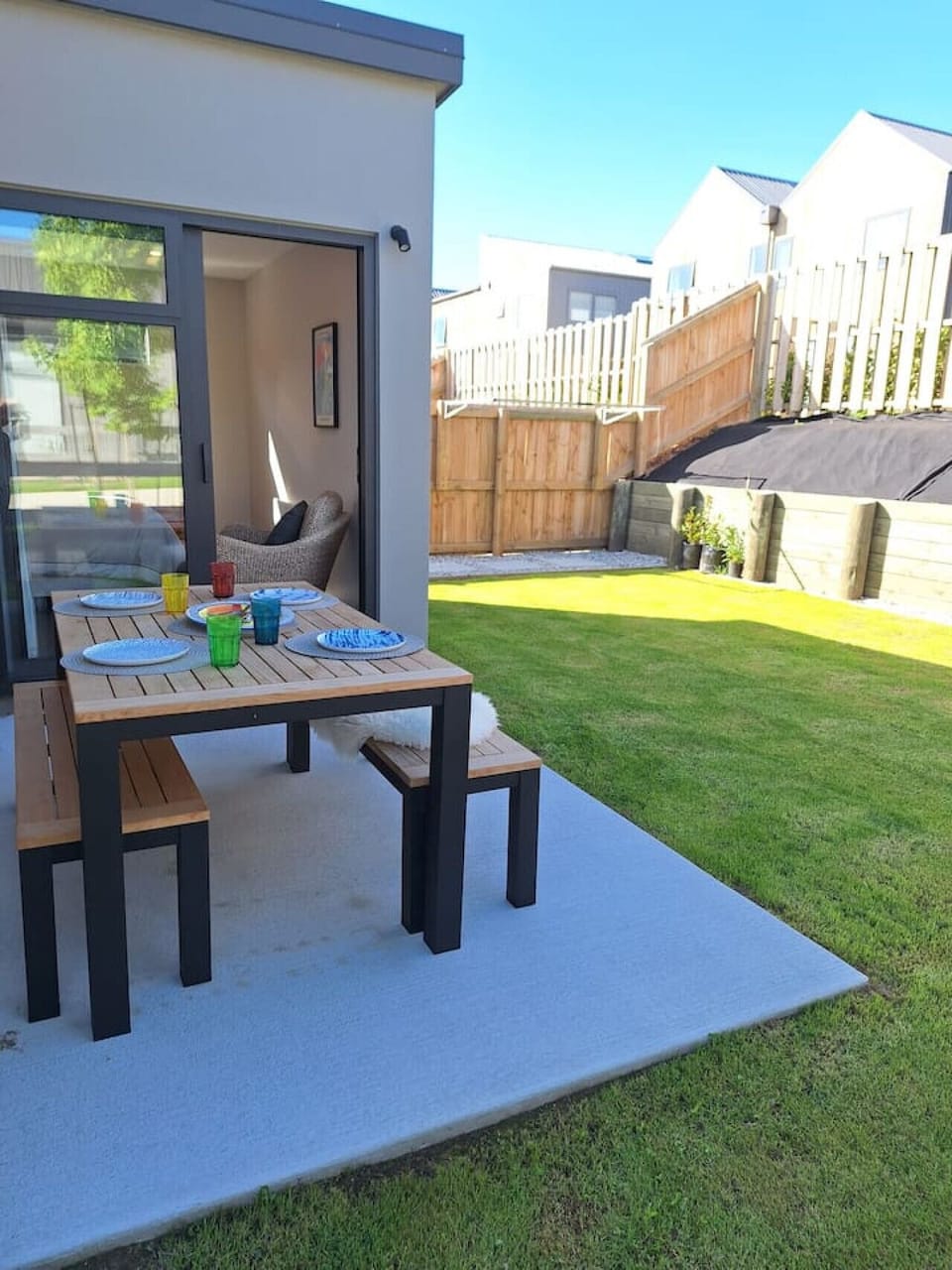 Outdoor dining area onto spacious back-yard.