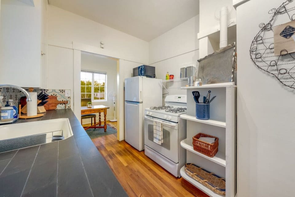 Full-size refrigerator/freezer, gas stove, and microwave
