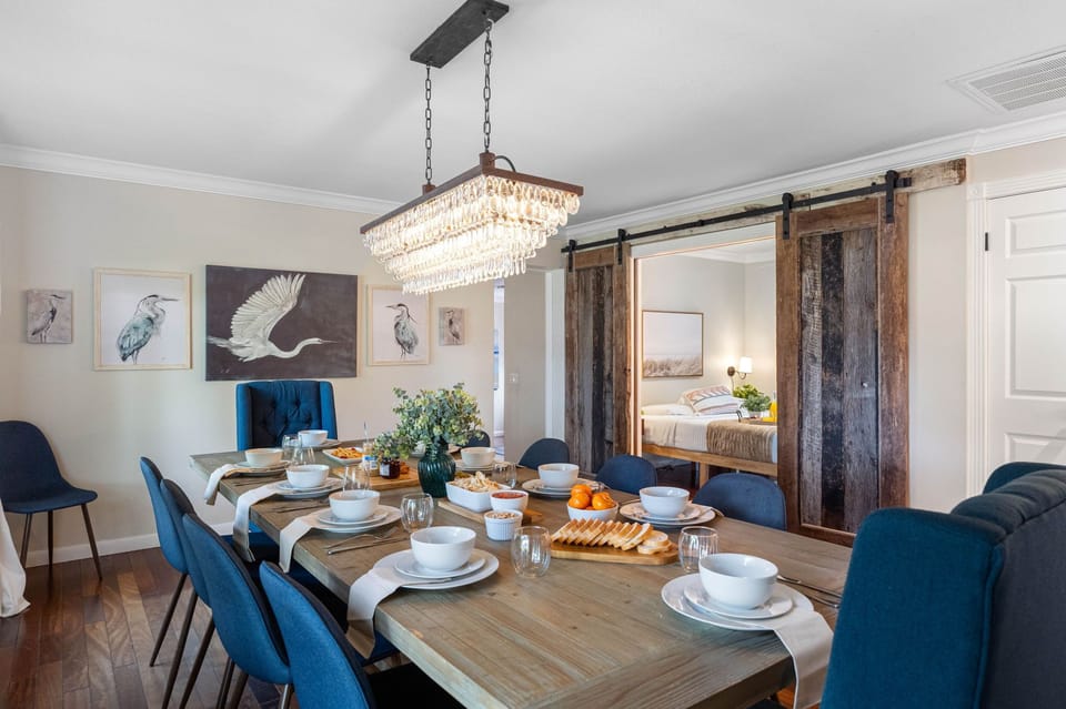 A perfect blend of modern and rustic charm with barn-style sliding doors and chic lighting.