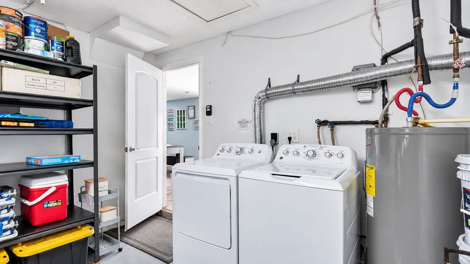 In-home laundry: pack light, stay longer. Full-size washer and dryer in the laundry area, plus storage shelves. Wash beach towels overnight and repack fresh for the next adventure.
