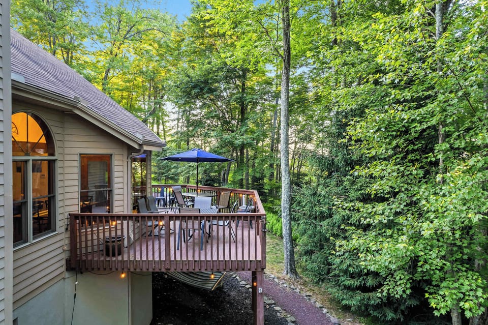 Take your coffee up to the deck at dusk — just you, the trees, and a few quiet minutes before the house wakes up.