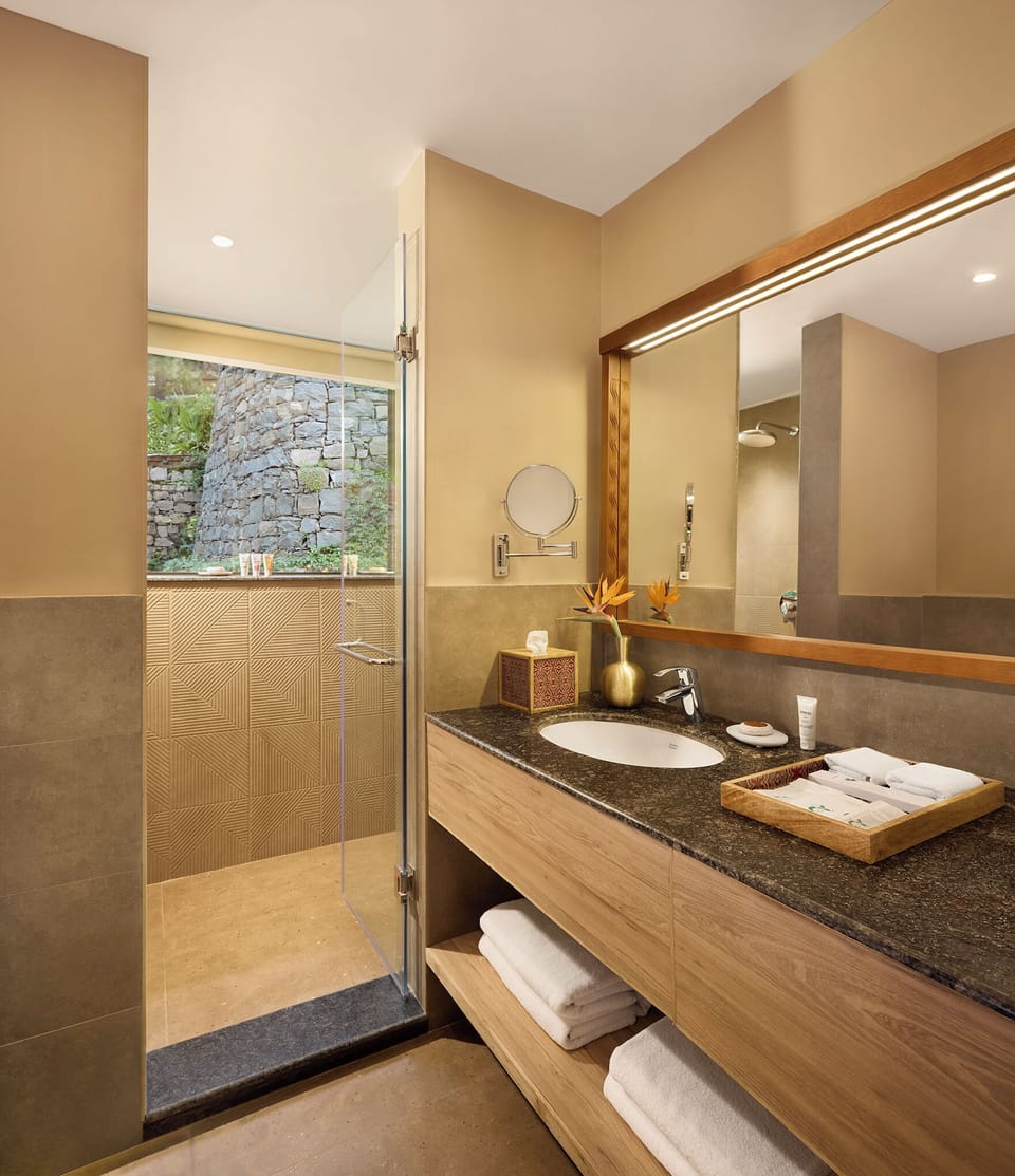 Suite, 1 King Bed (Cottage) | Bathroom | Designer toiletries, hair dryer, bathrobes, slippers