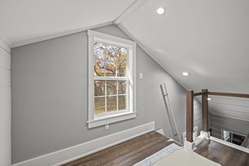 Bright loft and bedroom combination designed for flexibility and comfort, making this two-queen setup ideal for group stays in Mission, KS.