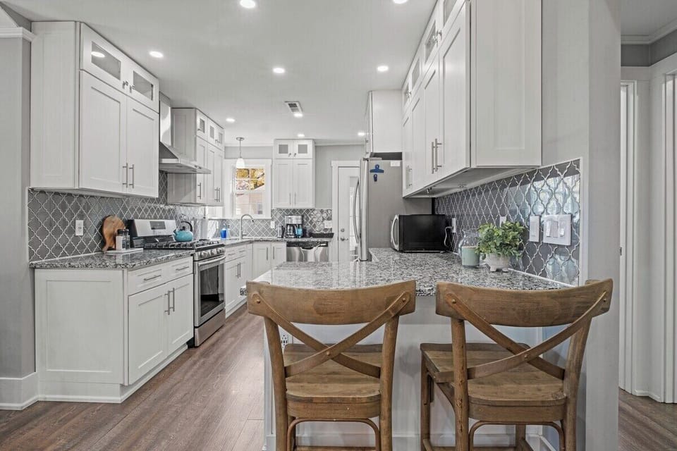 Open kitchen layout with breakfast seating, perfect for morning coffee or casual meals before heading to the Plaza or Downtown KC.