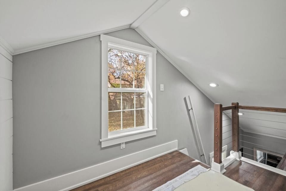 Bright loft and bedroom combination designed for flexibility and comfort, making this two-queen setup ideal for group stays in Mission, KS.
