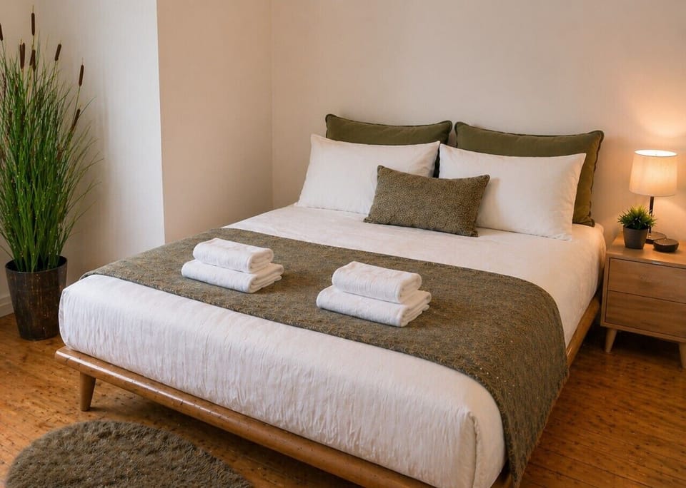 Relax in a warm and inviting bedroom designed for comfort.