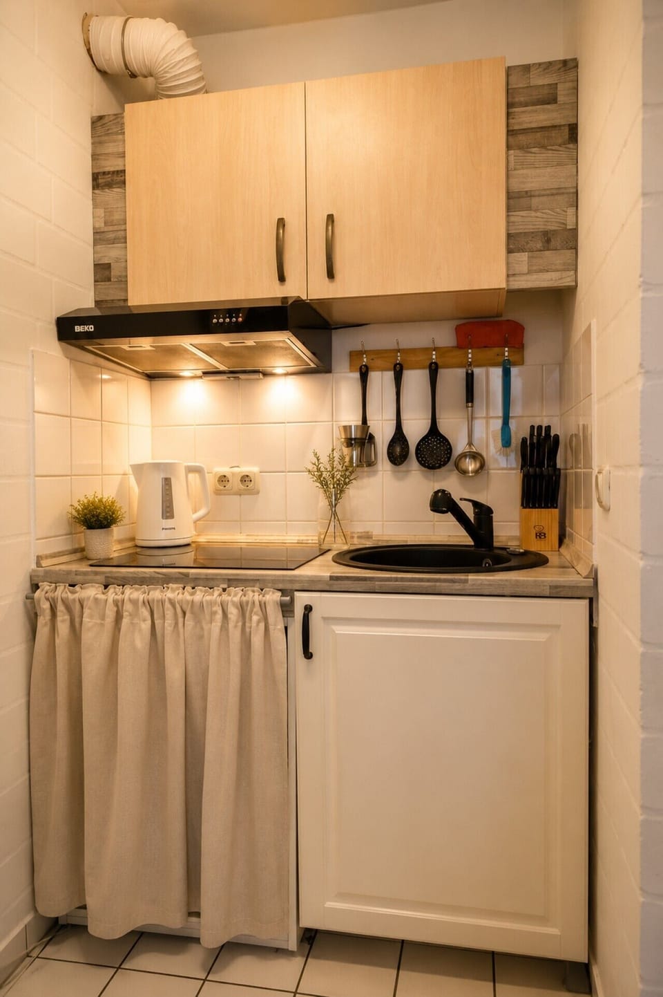 Enjoy the convenience of a functional kitchenette complete with cooking essentials, making it easy to prepare breakfast, snacks, or light meals at home.