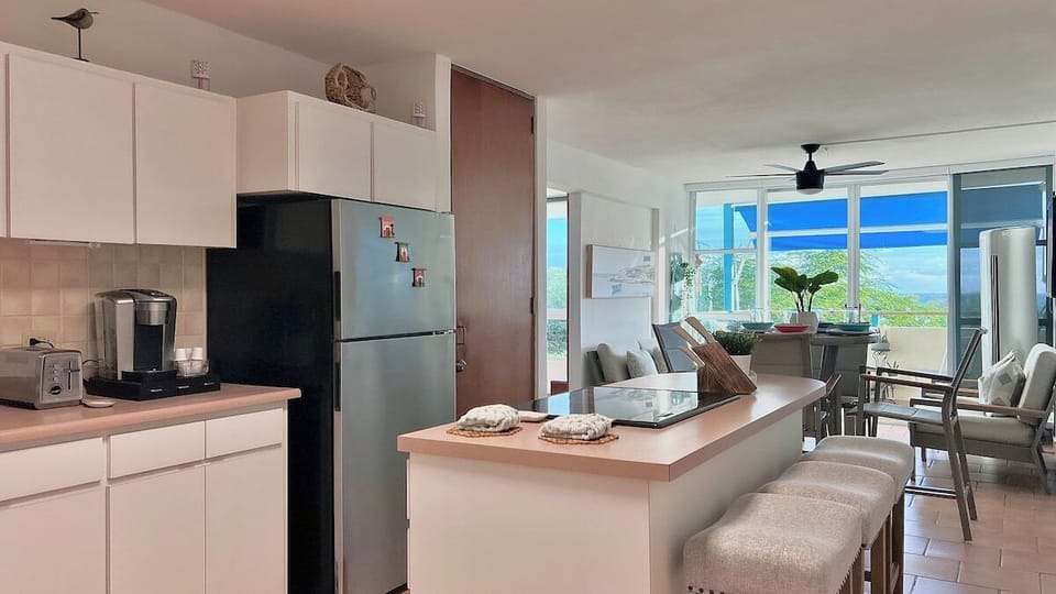 Kitchen, dinning area and living room all share a fully air-conditioned contemporary layout. 