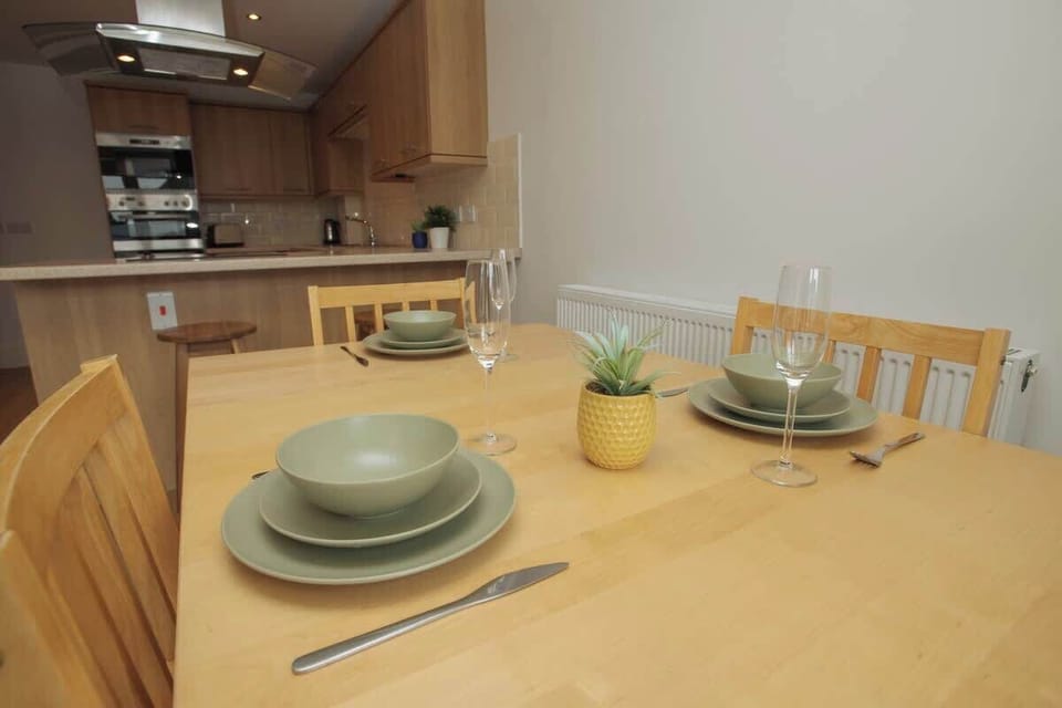 Enjoy peaceful meals in this simple first-floor dining area, featuring a cozy sofa set and a beautiful view of the backyard garden-where comfort meets nature.