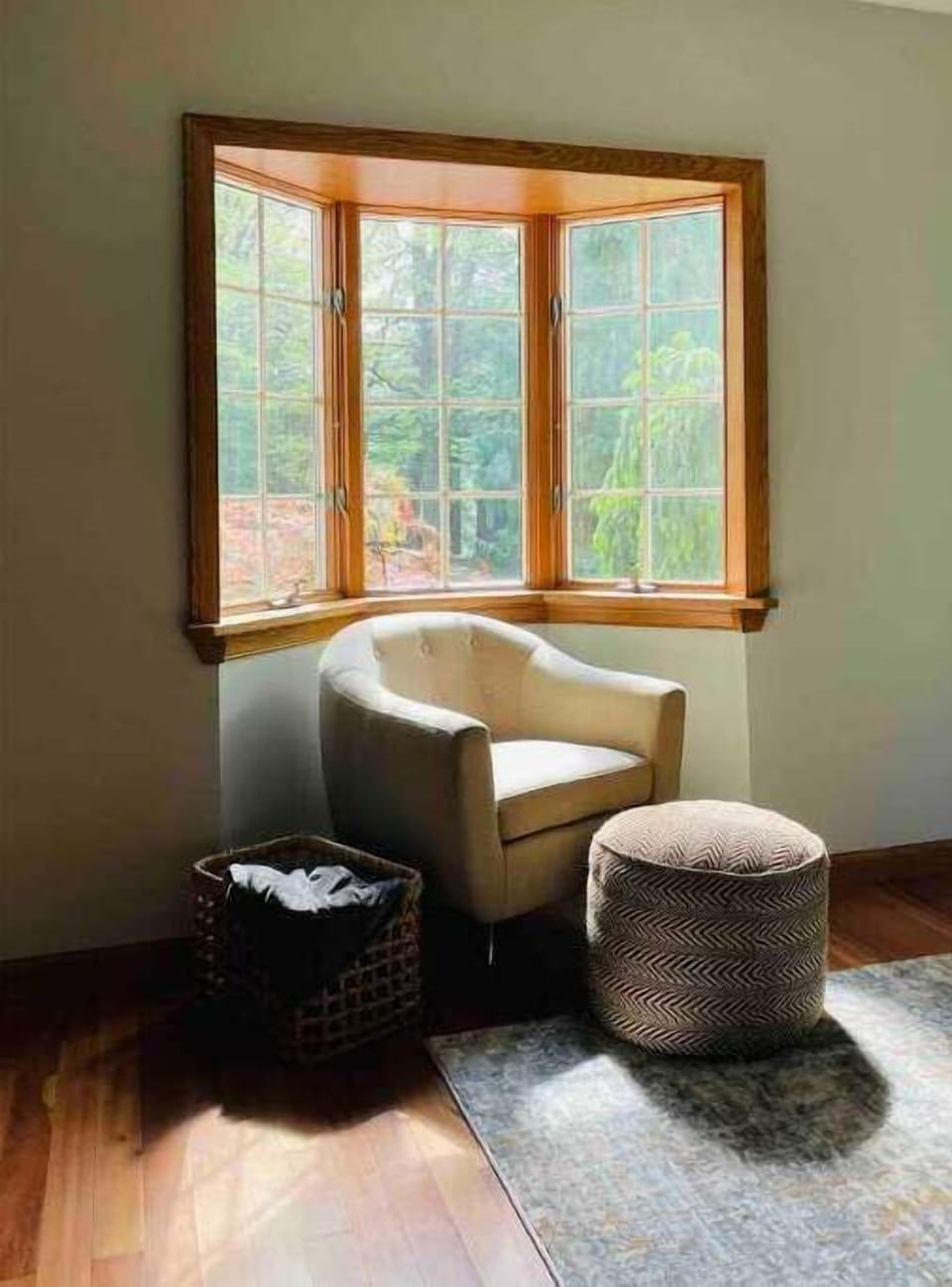 Book nook in master bedroom with forest views.