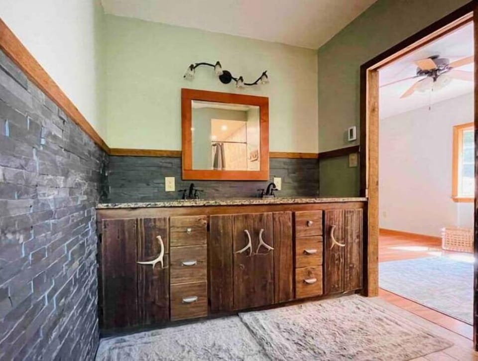 Ensuite master bath with double sinks and a large walk-in shower.