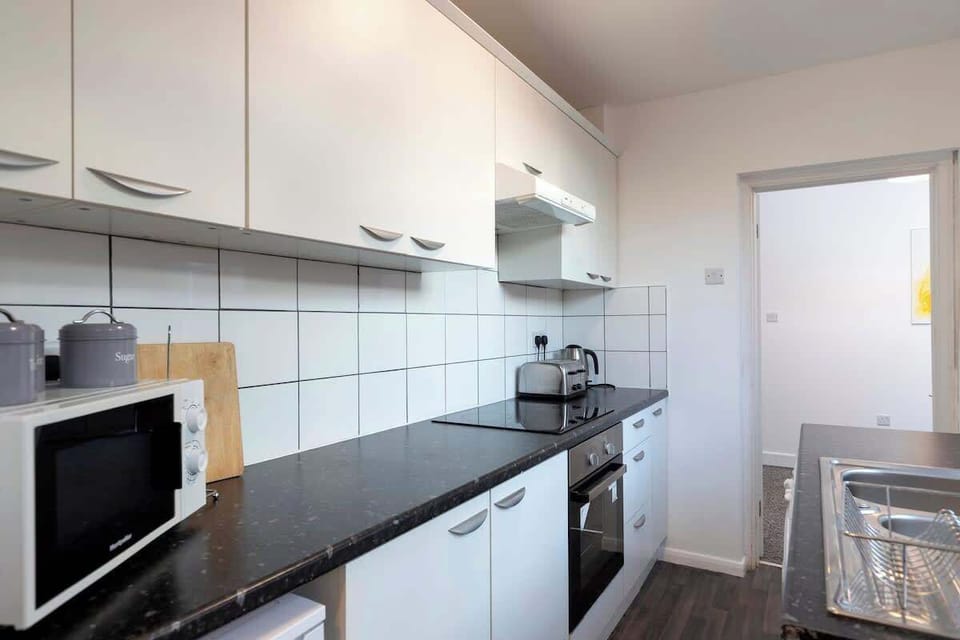 Whip up meals with ease in the fully equipped kitchen—stocked with all the essentials to make you feel right at home.