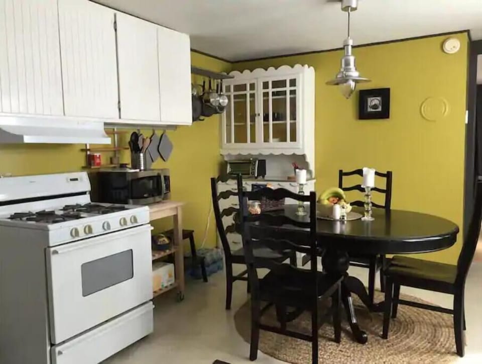 Oval dining table comfortably seats 4, plus you can add more chairs/stools.