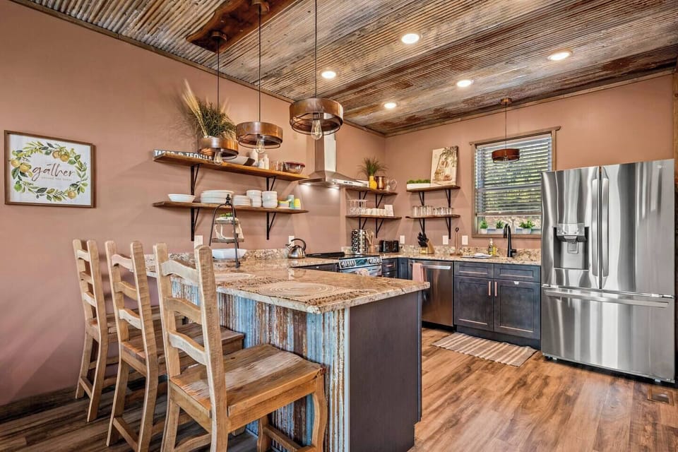 Fully-stocked kitchen with bar seating