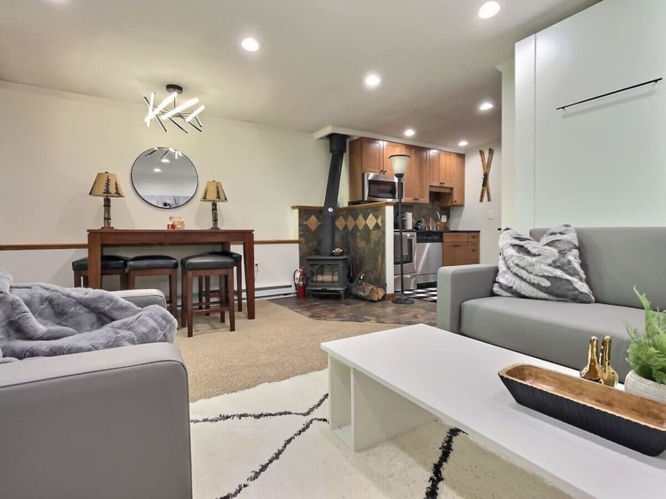 Cozy up by the fireplace in our heartwarming living room.