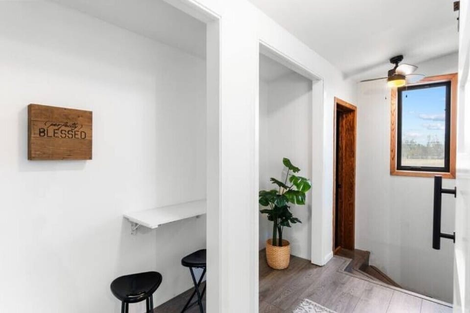 Upstairs hallway with seating for more space to get ready.