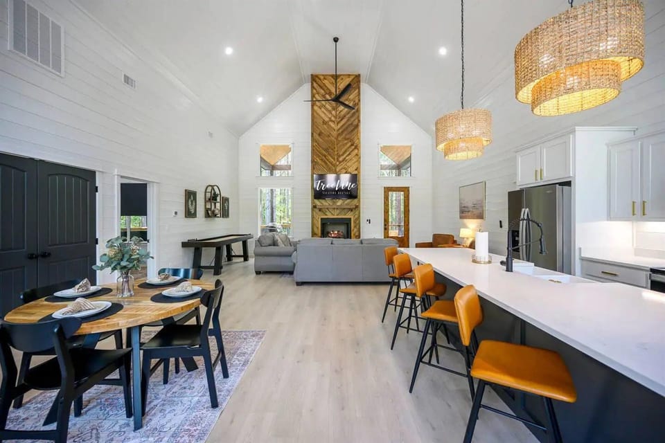 Flow effortlessly from cooking to dining to unwinding in this open-plan setup.