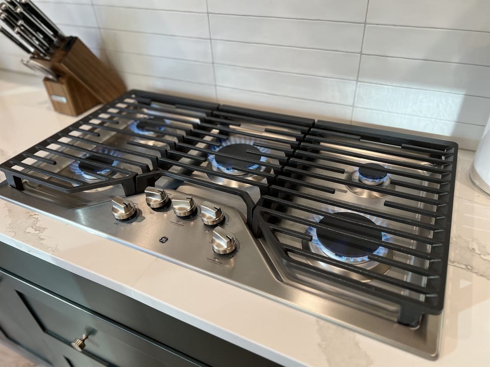 Space to cook for a group on the 5-burner gas cooktop. 