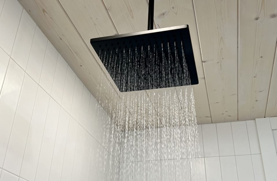 Mimicking gently falling raindrops, energize and rejuvenate under the large rain showerhead.