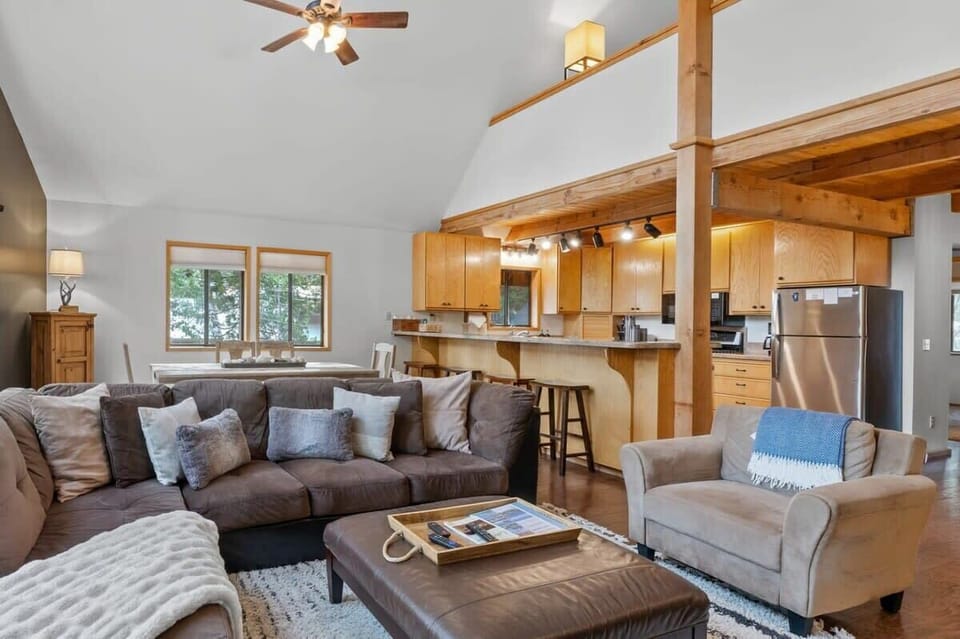 The bright and inviting main level boasts a living room/dining/kitchen that seamlessly blends together in an open layout.
