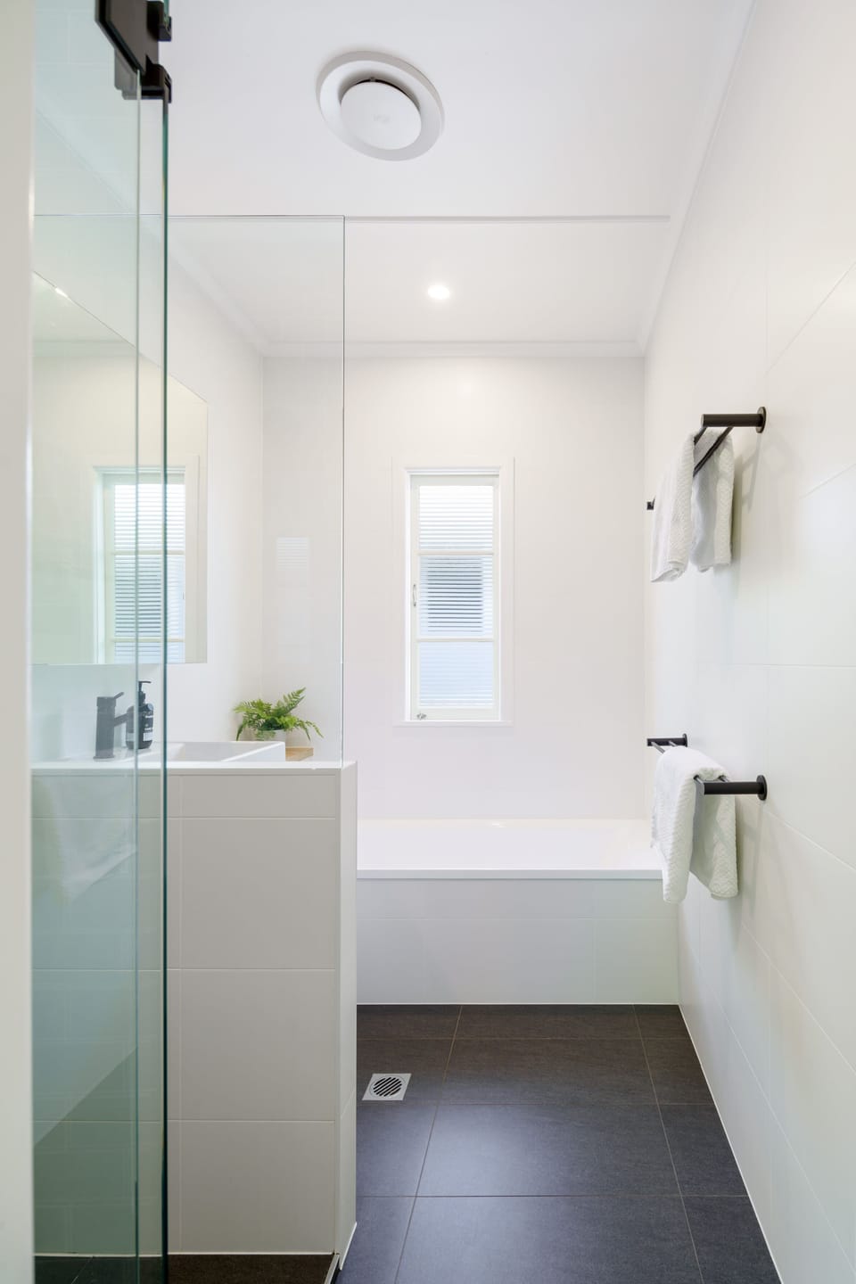 Clean and comfortable bathroom provides everything guests need for an easy coastal stay
