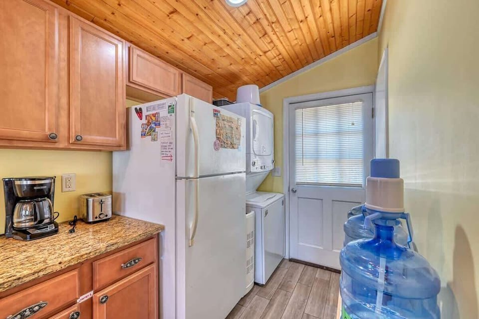 Kitchen and Stacked Washer Dryer