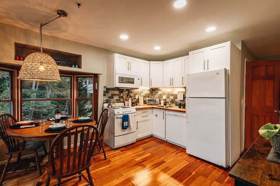 Cozy kitchen with adjacent dining table and bench/