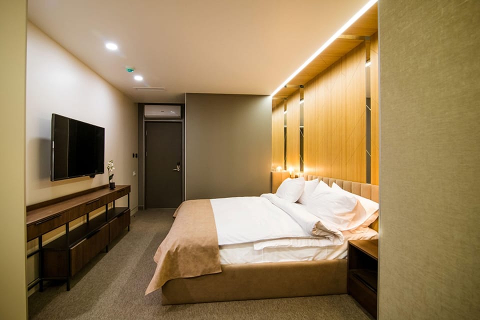 Family Triple Room | Premium bedding, minibar, individually decorated, individually furnished