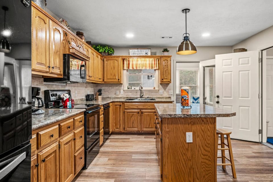 Fully stocked kitchen with additional island seating for four