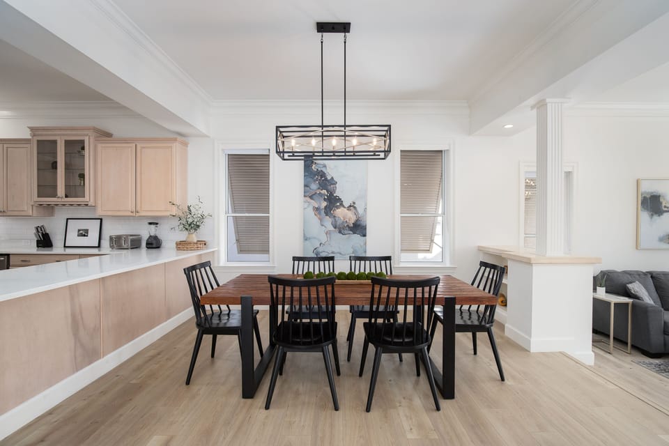 Gather around your dining table where warm wood meets modern style, perfect for memorable meals and conversations with loved ones.