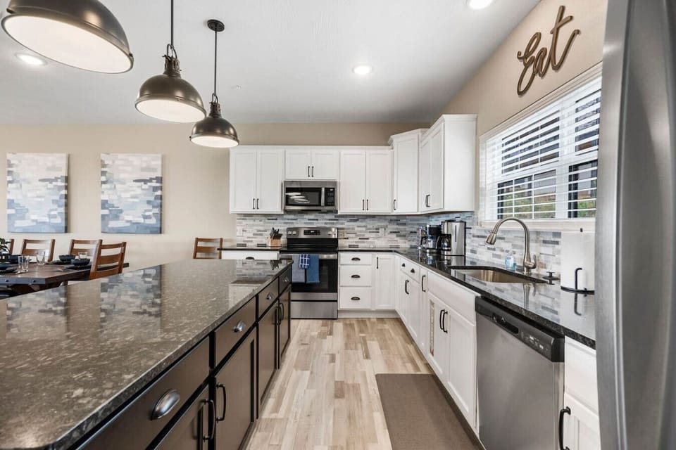 Large kitchen island offers lots of room for meal prep or a food buffet! Stocked coffee station and wine glasses provided!