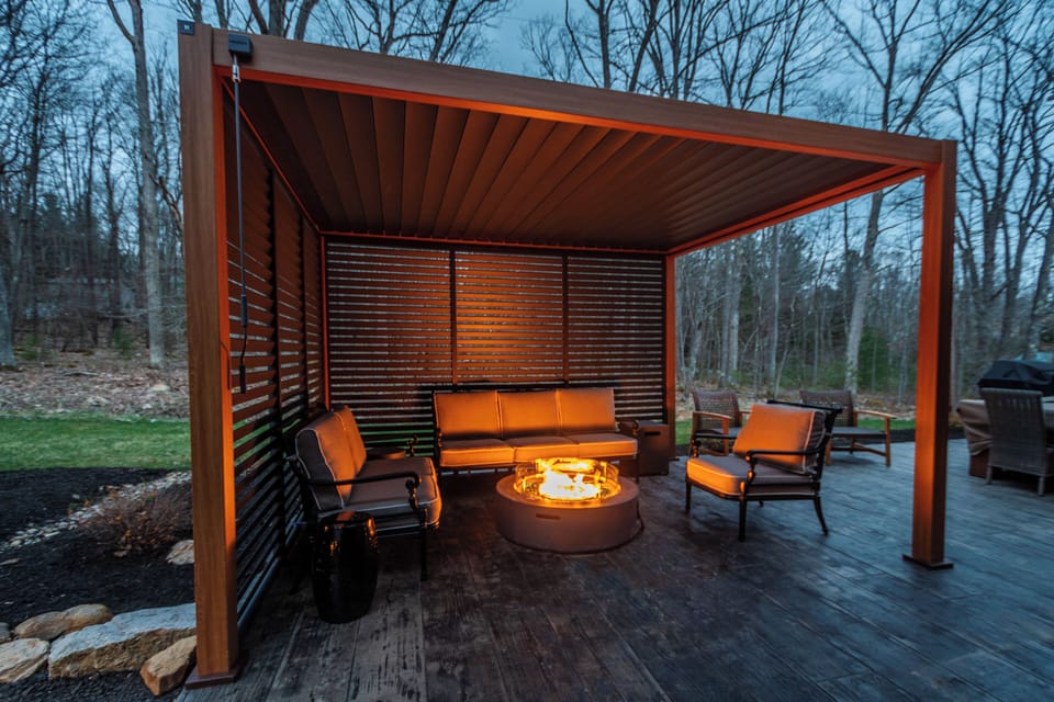 Relax under the shade of the pergola or get cozy by the fire pit.