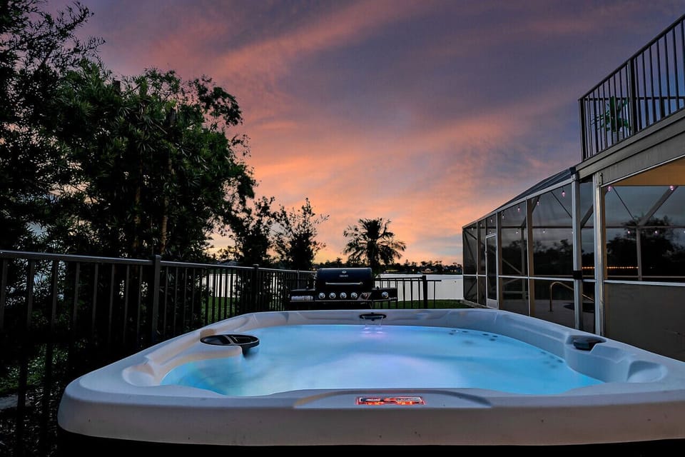 Outdoor hot tub in private yard w BBQ grill