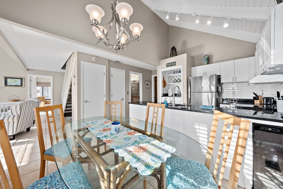 The dining area is off the kitchen and opens to the living area