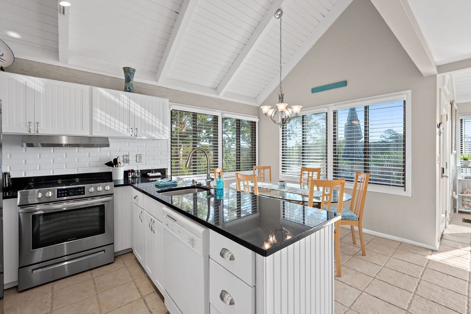 The kitchen has been updated with granite counters, custom cabinets and stainless steel appliances