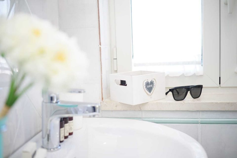 Deluxe Room, Non Smoking, Sea View | Bathroom | Shower, rainfall showerhead, hair dryer, bathrobes