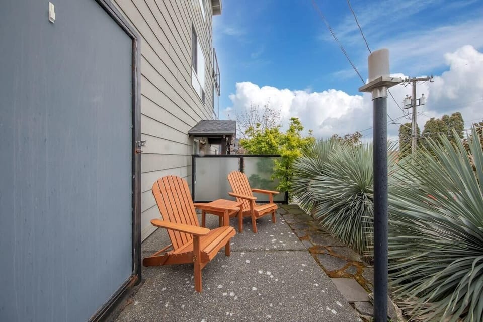 There are 2 outdoor chairs that you could chill here