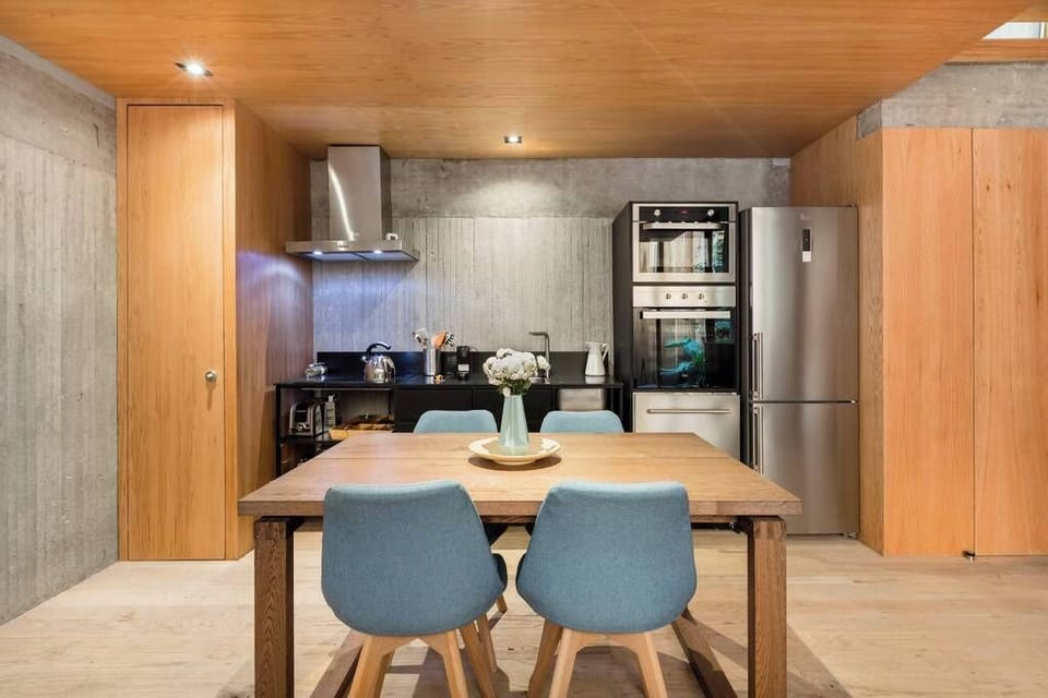 Prepare gourmet meals in your fully equipped kitchen with a stylish dining area.
