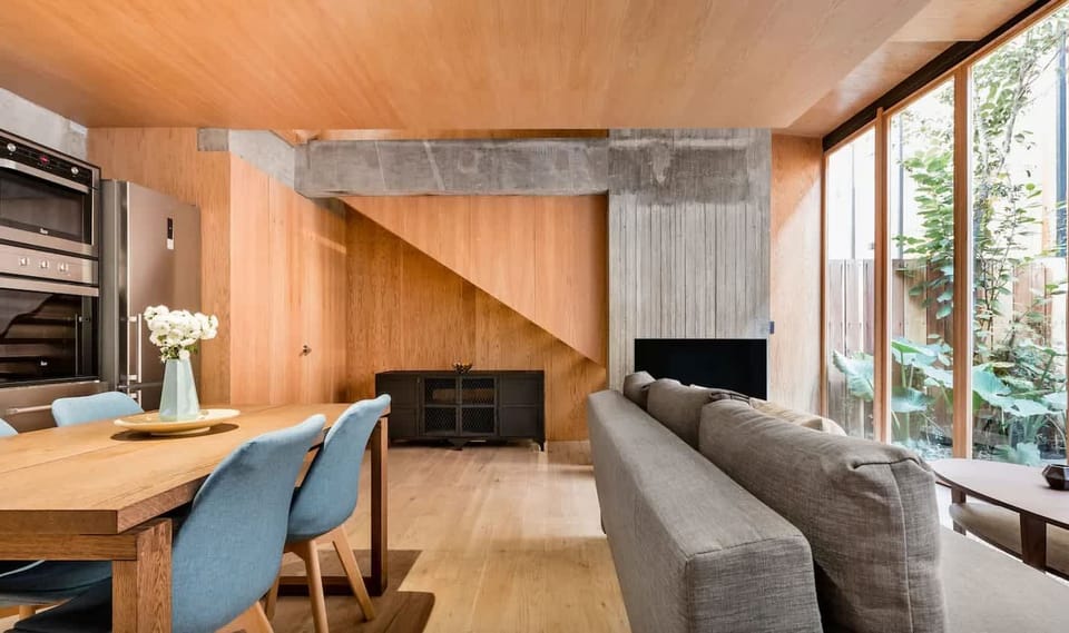 The open layout connects kitchen, dining, and living spaces so nobody feels isolated while cooking or working.