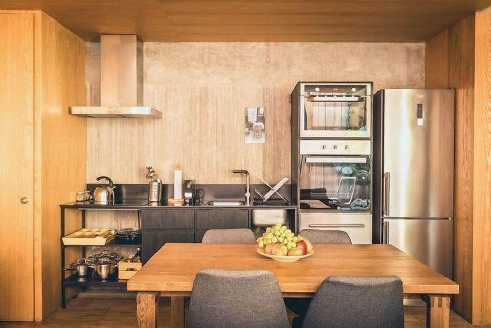 Modern dining area and kitchen, ready for memorable meals in a stylish setting.