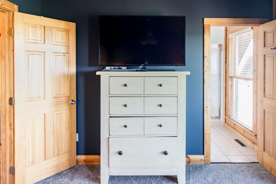 Dresser and Roku TV in primary bedroom