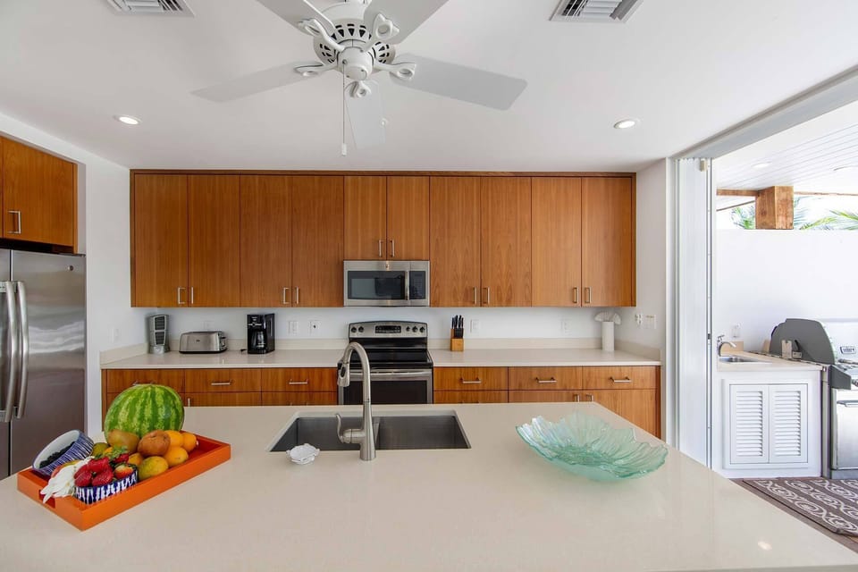 Kitchen opens to exterior grilling area