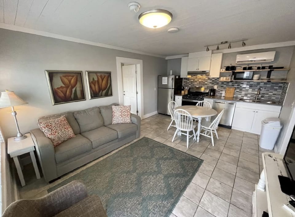 Venue Condos | Living area | 50-inch TV with cable channels
