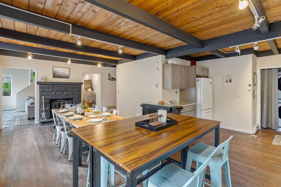 Seating for 12. Contemporary farmhouse dining set for 8 with a secondary bar height dining table set for 4 stools. You can find an additional set of 4 bar-height stools and tables in the game room for additional seating and table space.
