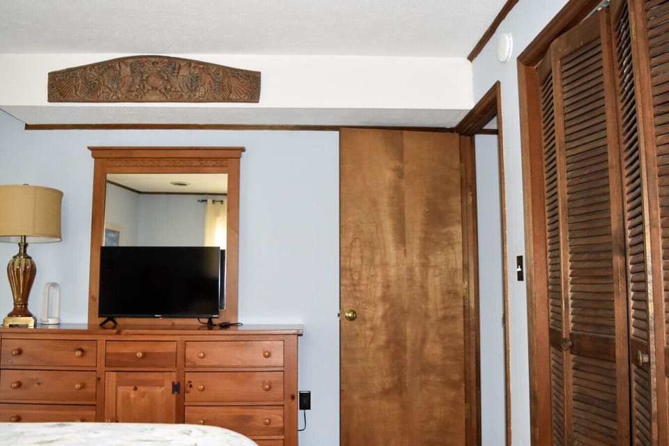 Rest comfortably in our charming guest bedroom with a queen-sized bed and cheerful accents