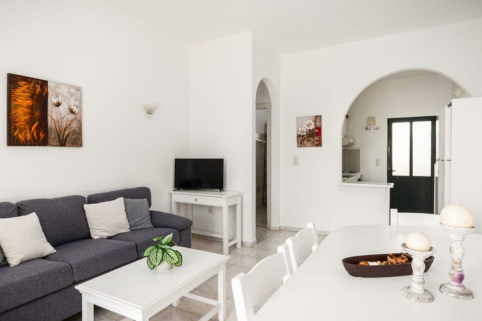 Villa | Living area | 32-inch flat-screen TV with satellite channels, DVD player