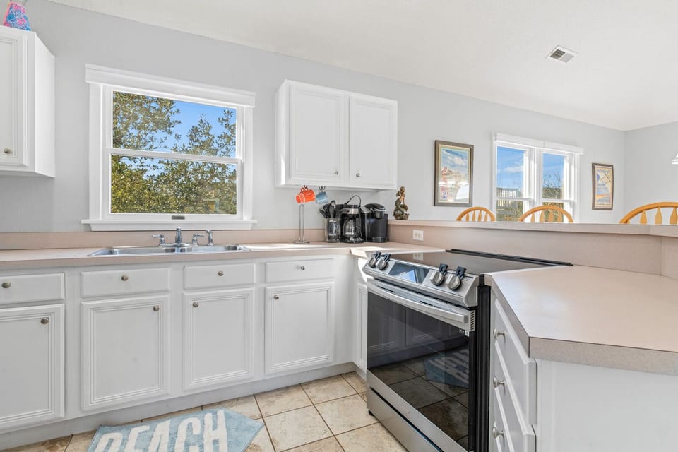 Kitchen with Bar Seating on Third Level