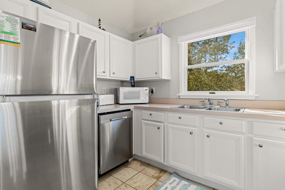 Kitchen with Bar Seating on Third Level