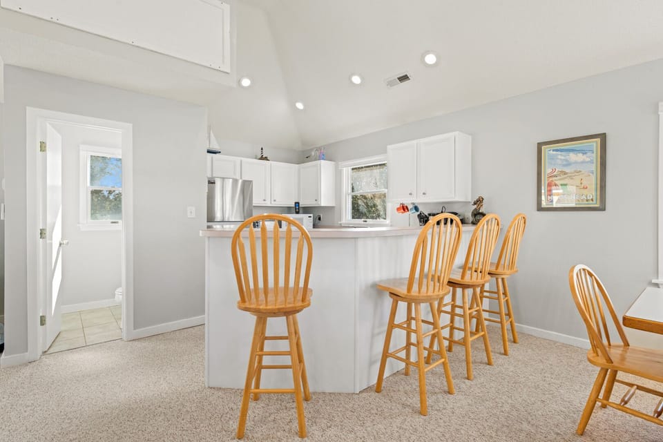 Kitchen with Bar Seating on Third Level