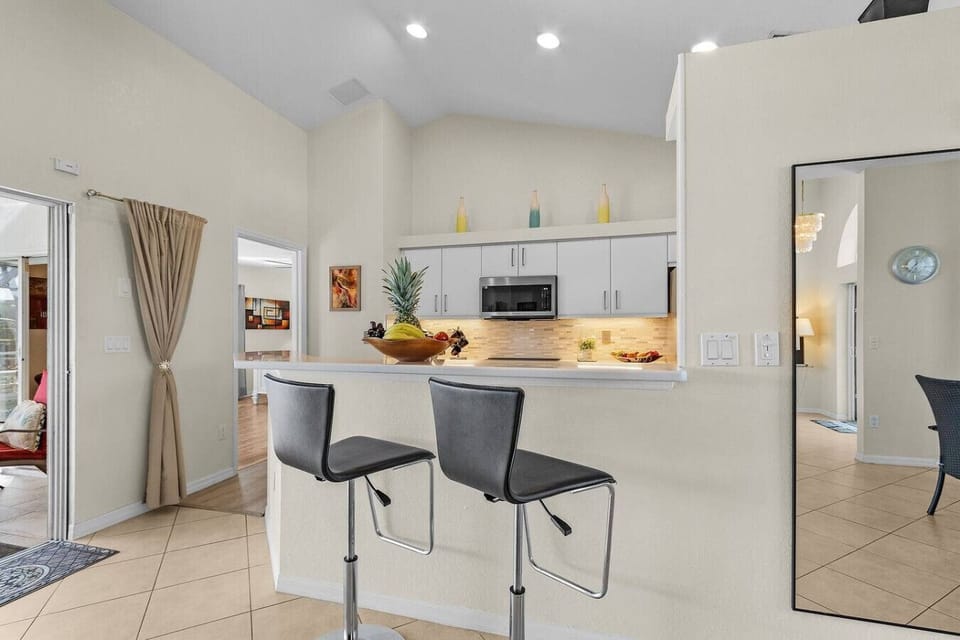 Enjoy casual meals or morning coffee at the breakfast bar, with comfortable seating overlooking the kitchen.